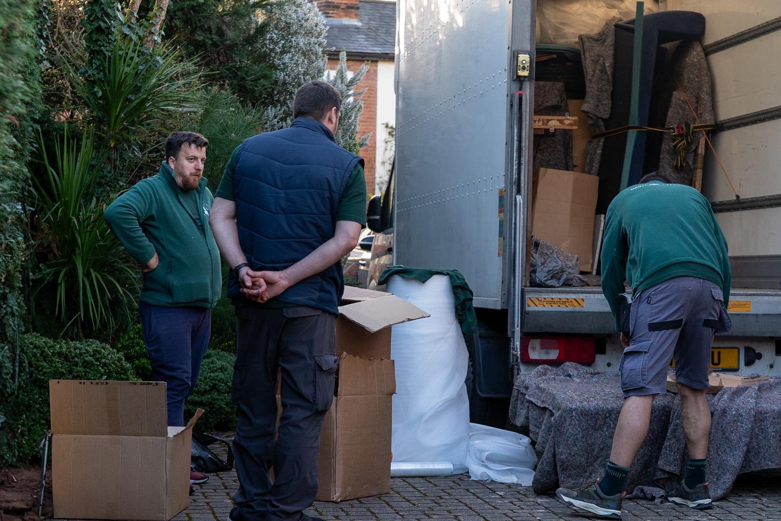 White Glove Surrey team preparing items beside a removals van