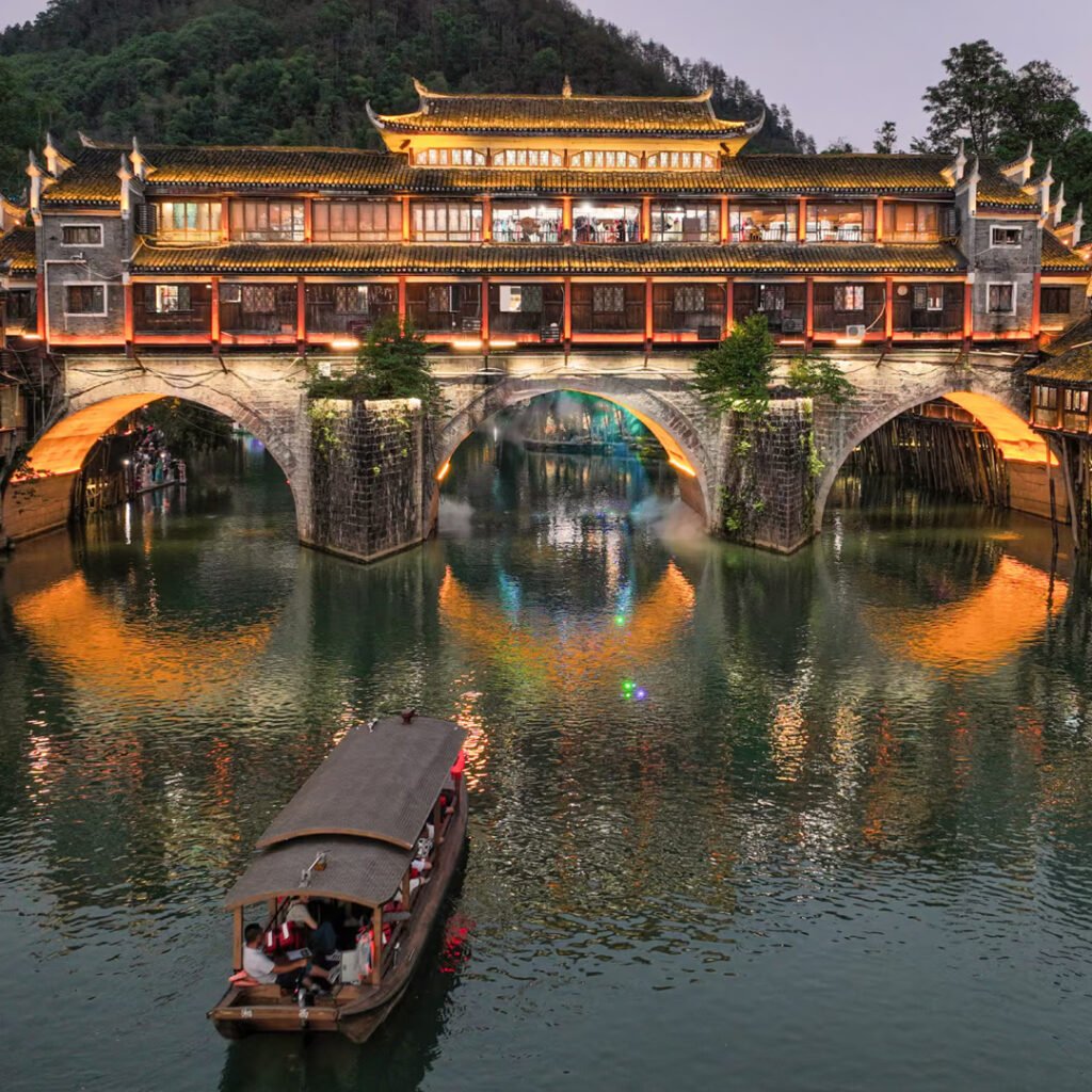 Traditional Chinese bridge over a river at night