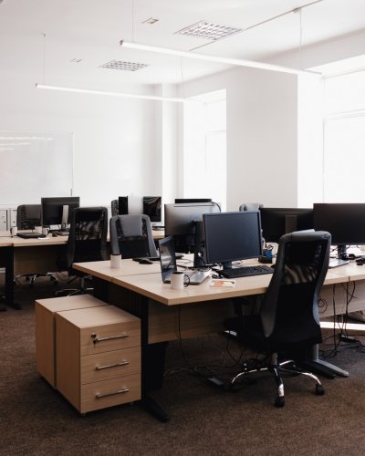 Modern open-plan office with desks and computers