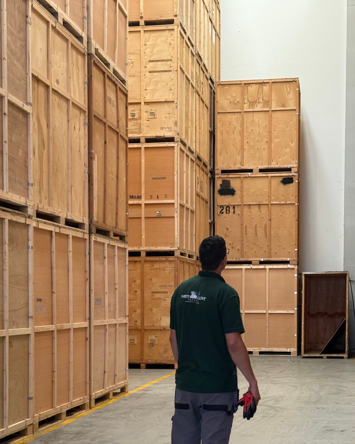 Stacked wooden storage crates in the White Glove Surrey warehouse